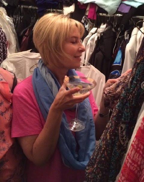 Cleaning closet with a martini in hand